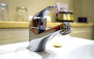 A water faucet on a sink close up